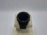 an image of a smart watch sitting on a stand on a white surface
