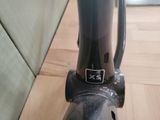 a close up of a bike handle on a wooden floor