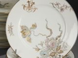 many plates stacked on top of each other on a table