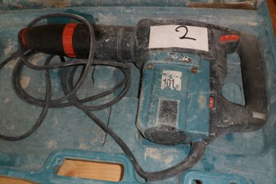 an electric drill in a case with a number 2 on it