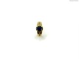an image of a gold ring with a blue stone on it