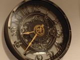 a clock that is hanging on the wall in the room