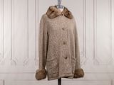 an image of a coat with a fur collar on a mannequin