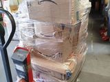 boxes stacked on top of each other on a dolly in a warehouse