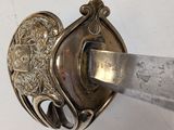 a knife stuck in the middle of a metal object
