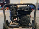 a close up of a small engine on a pallet in a warehouse
