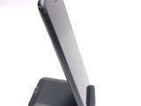 a cell phone that is sitting on top of a stand