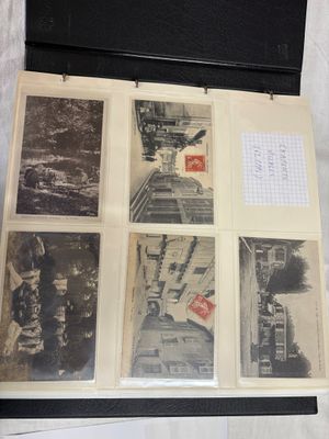 a black and white photo of old photographs in a case