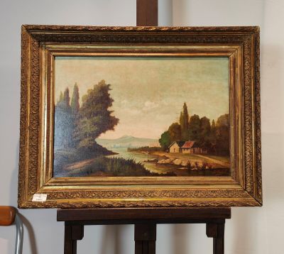 une image d'un tableau sur un chevalet dans une pièce