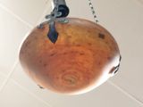 a ball hanging from the ceiling with a chain around it