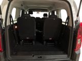 two seats in the back of a van with the doors open