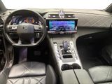 the interior of a car with a steering wheel, dashboard, and a touch screen