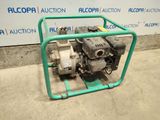 a small pump that is sitting on the ground