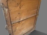 a wooden box with a statue on top of it