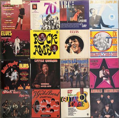 a lot of records on the wall of a room