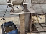 a machine that is sitting on the ground next to a box