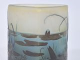 a glass cup with a picture of a boat in the water