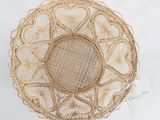 a close up of a woven basket on a white surface