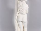 statue of a woman with a shaw around her neck