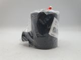 a roll of black tape wrapped in plastic on a white surface