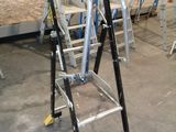 many ladders that are sitting in a room