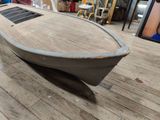 a boat that is sitting on the floor in the room