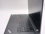 a black laptop computer sitting on top of a white table