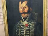 tableau représentant un homme avec une moustache et une barbe, dans un cadre doré