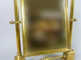 a mirror that is sitting on top of a stand