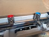 a picture of a faucet that is in a box