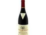 a close up of a bottle of wine on a white background