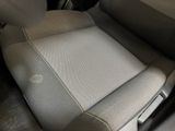 a dirty seat in the back of a car