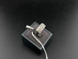 an image of a ring on a black box with a price tag attached to it