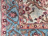 a close up of a rug on a white surface