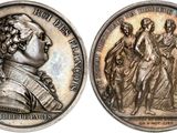 a close up of a coin with a woman on it