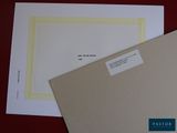 two sheets of paper sitting on a table next to each other