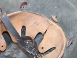 a brown bag with a leather handle and a pair of scissors in it