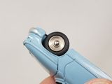 a person holding a small toy car in their hand