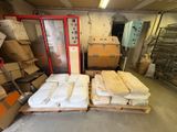 many boxes of mattresses on pallets in a warehouse