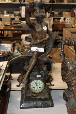 a statue of a woman sitting on top of a clock