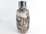a vase with a painting on it on a white background