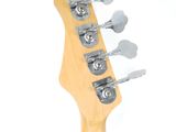 an image of a guitar neck with four strings and a guitar picker
