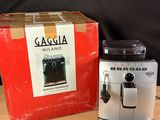 a coffee machine sitting next to a box on a table