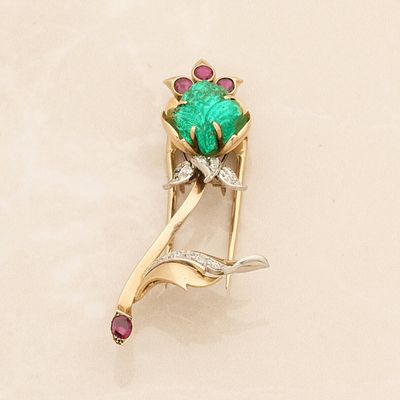 yellow gold brooch with a green stone and pink stones
