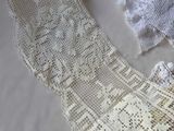 a white lace on a table next to a pair of scissors
