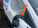 a van that has been wrapped up with a plastic sheet