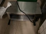 a metal table with a green box on top of it