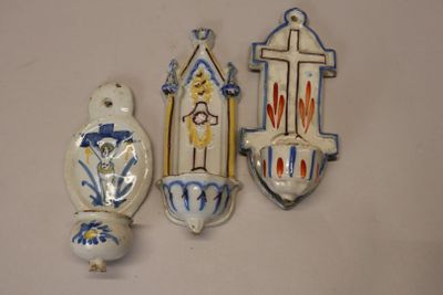 three decorative items that are on a white surface