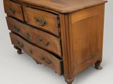 an image of a wooden dresser with three drawers on top of it