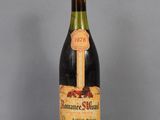 a bottle of wine that is sitting on a table